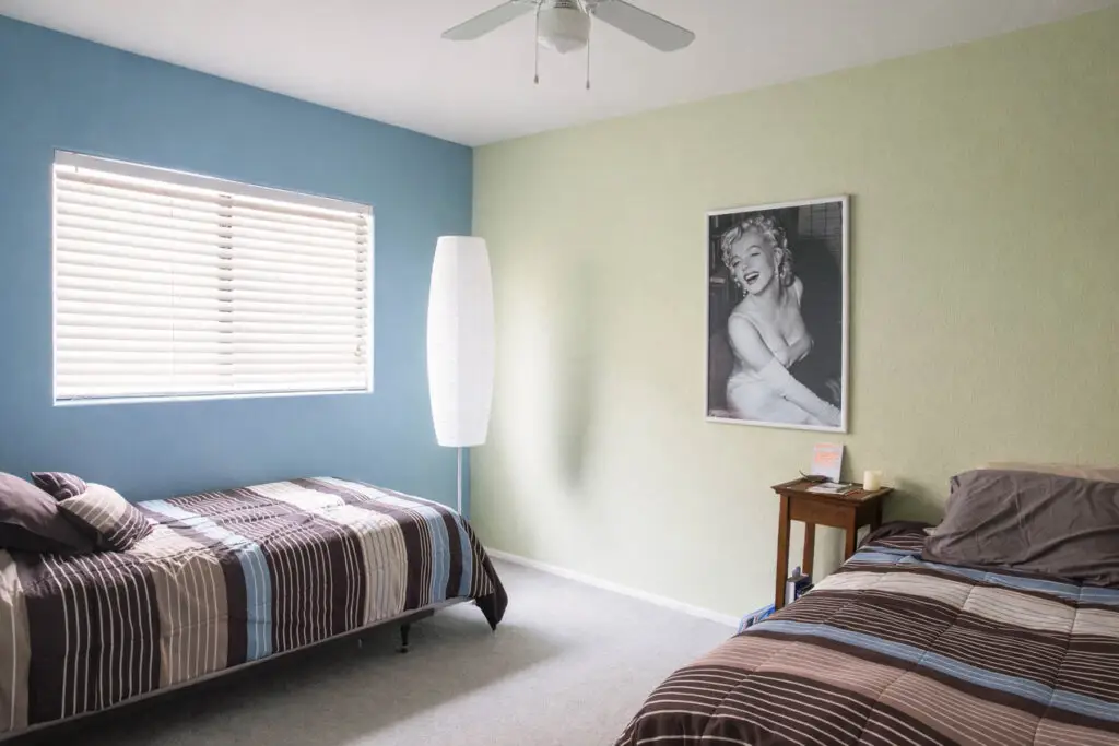 Semi-private bedroom with two beds at Arminta House men's sober living